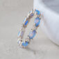 ML_pdp_Fire_opal_eternity_band_lifestyle_blue_silver