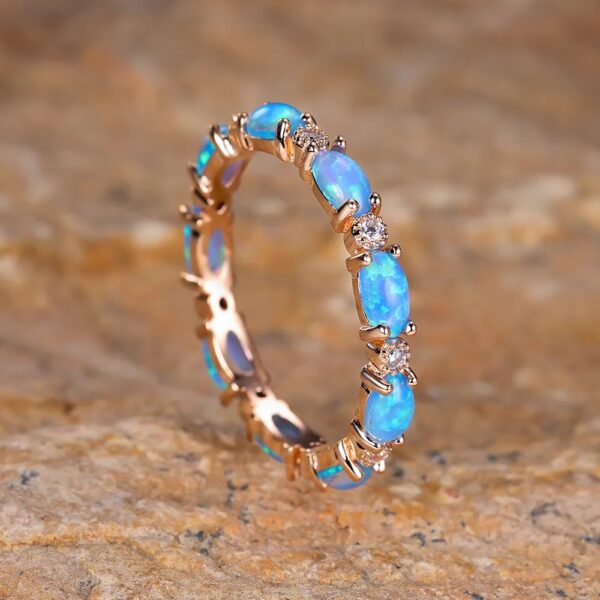 fire_opal_eternity_band-gold-blue-2_8e83d7f8-65e7-4190-9607-8b5e4b515f6e